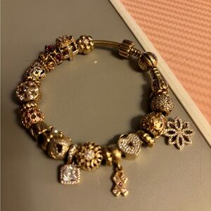 Pandora 14k gold bracelet with 14k charms